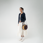A Celestial Circle Crossbody being worn by a model