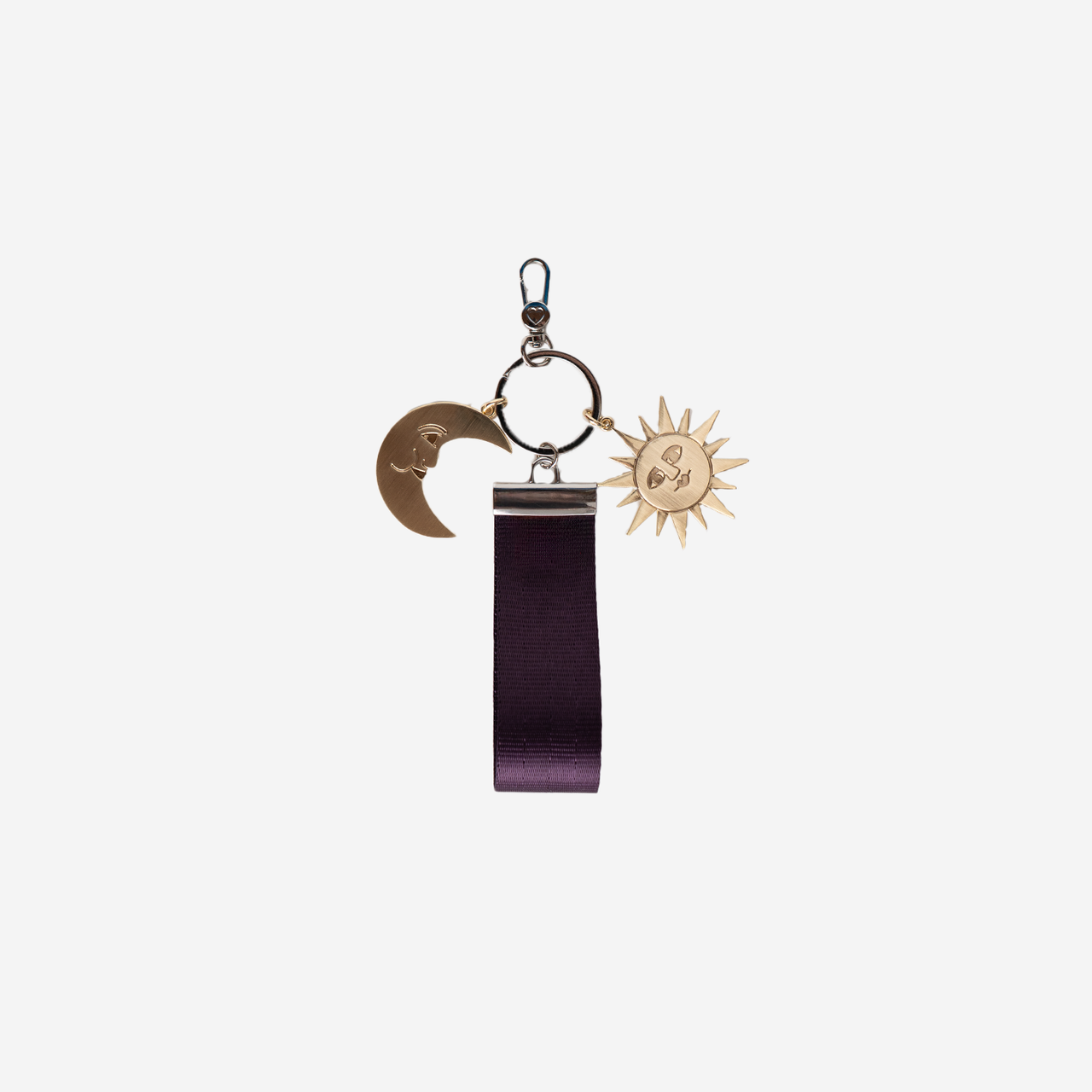 The front of a Celestial Seatbelt Key Charm