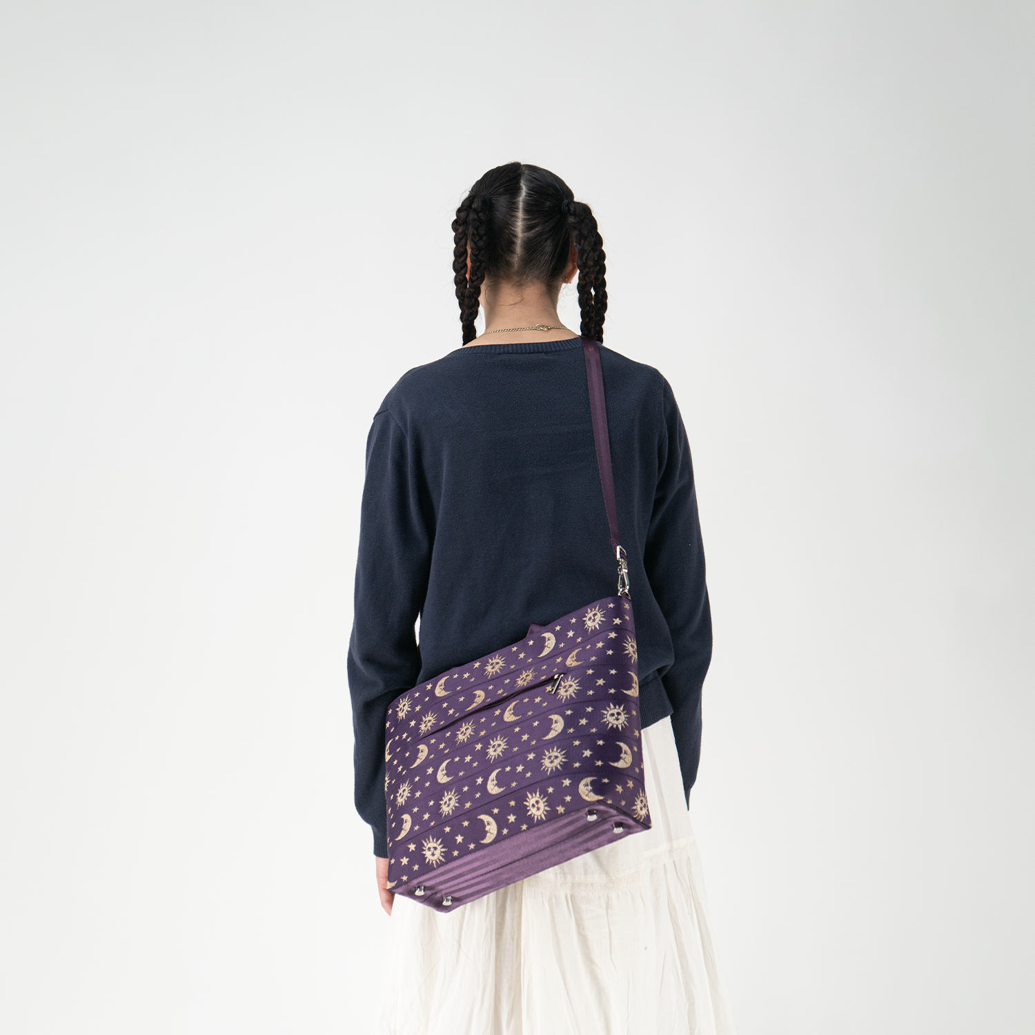 A Celestial Medium Streamline Tote being worn by a model
