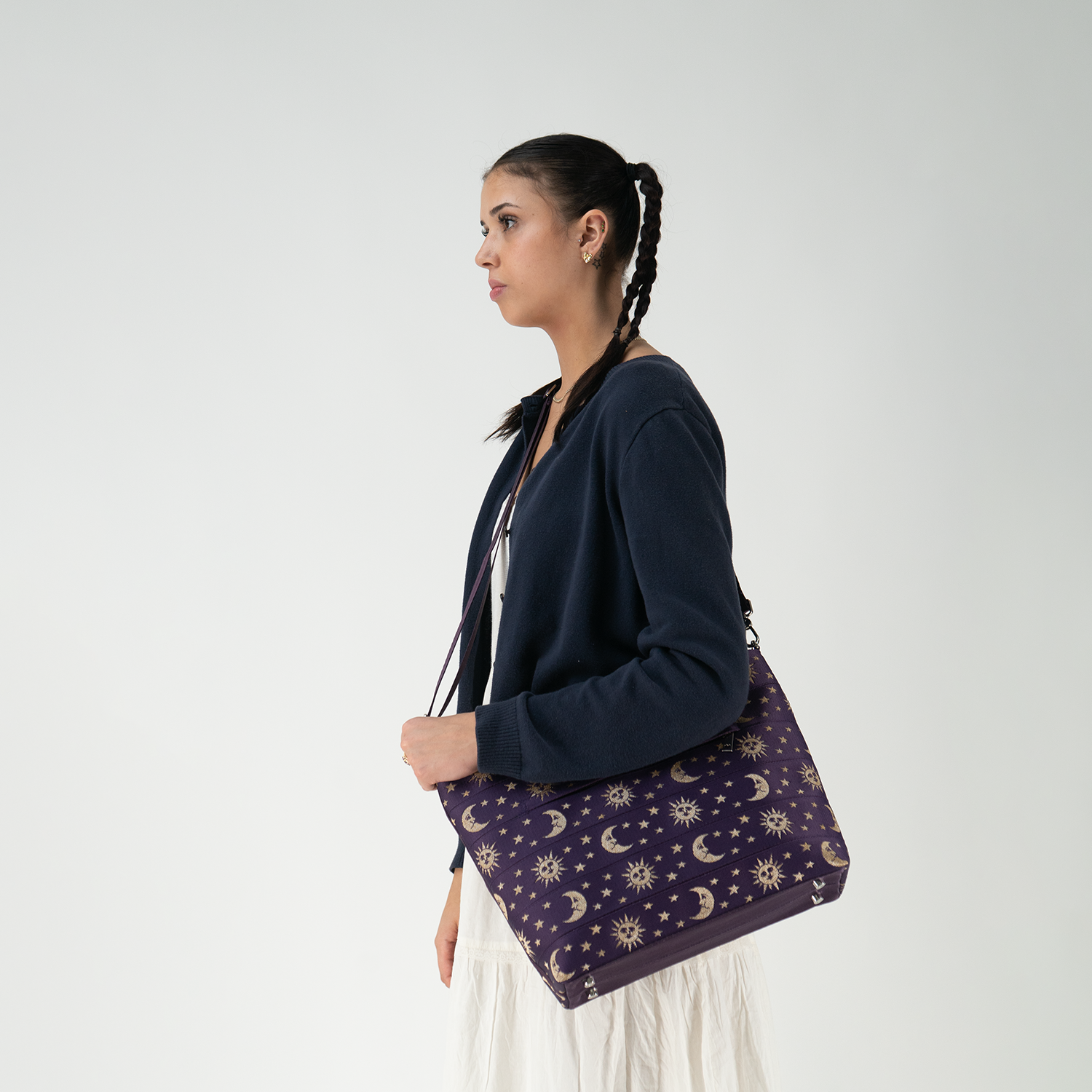 A Celestial Medium Streamline Tote being worn by a model