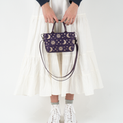 Celestial Petite Tote in a models hands