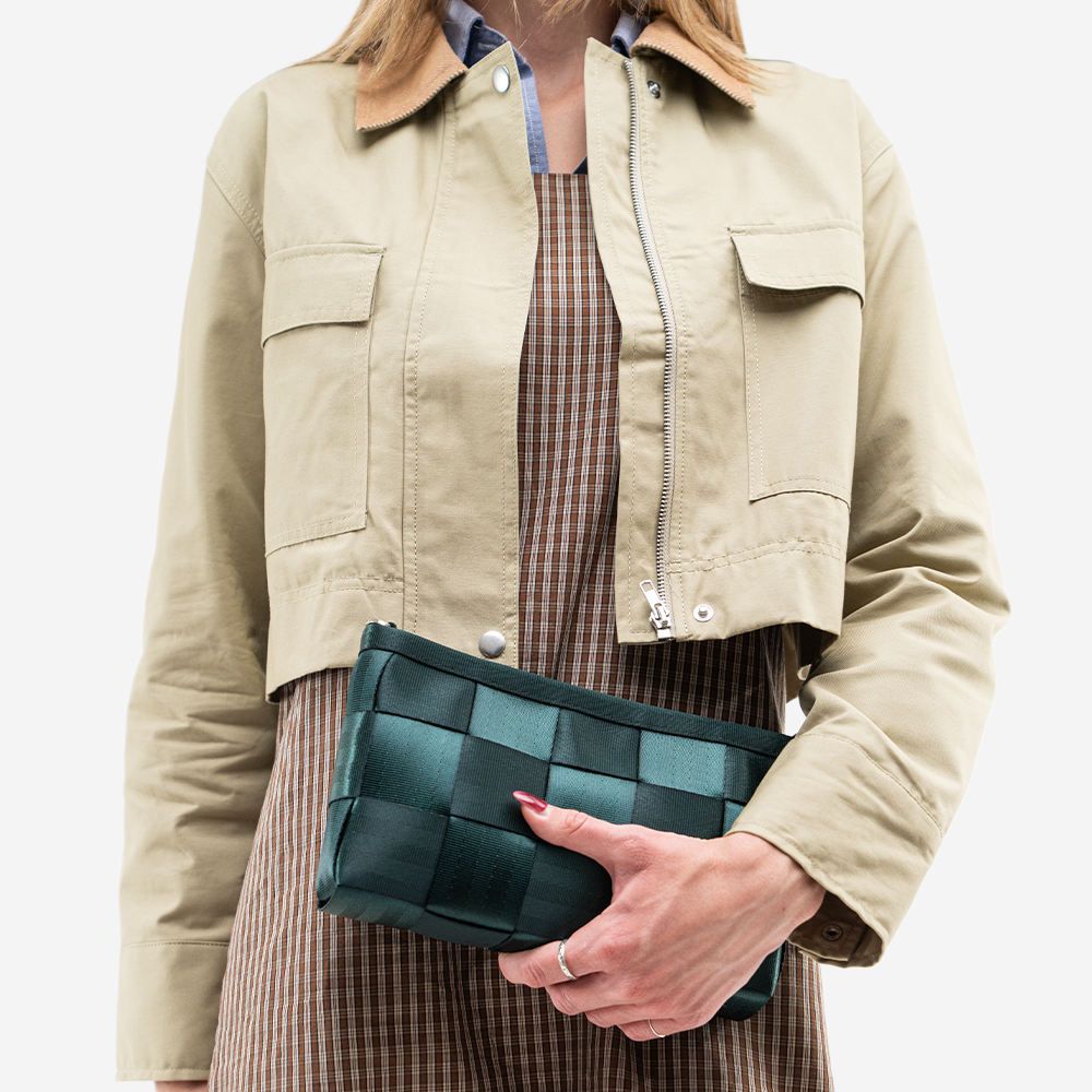 The Convertible Clutch in Nori being worn by a model