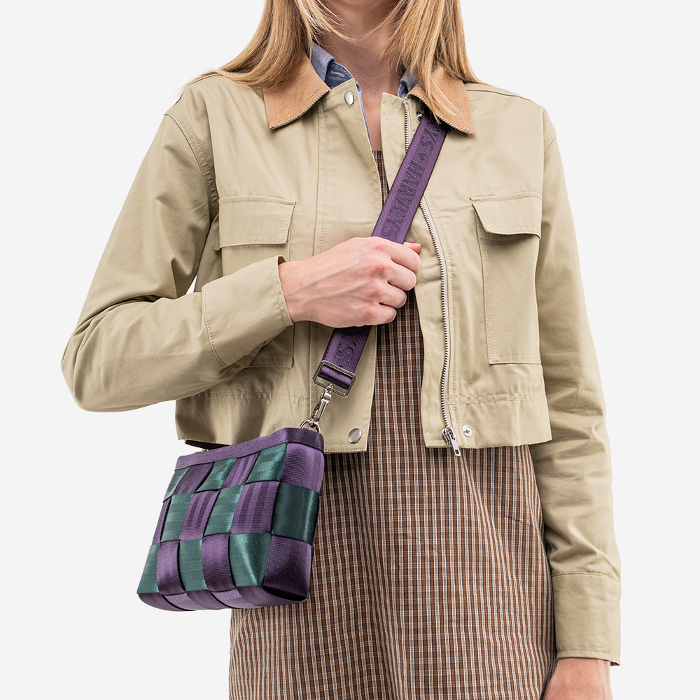The Convertible Clutch in Poison Ivy being worn by a model