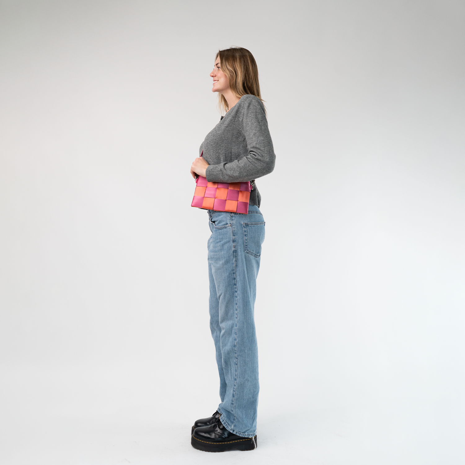 The Coral N Fuchsia Hip Pack being worn by a model