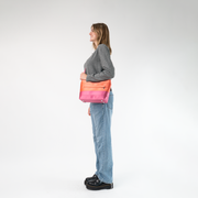 The Coral N Fuchsia Mini Streamline Tote being worn by a model
