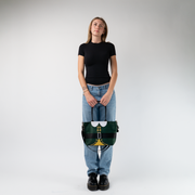 The Elf Mini Streamline Tote being held in a models hands