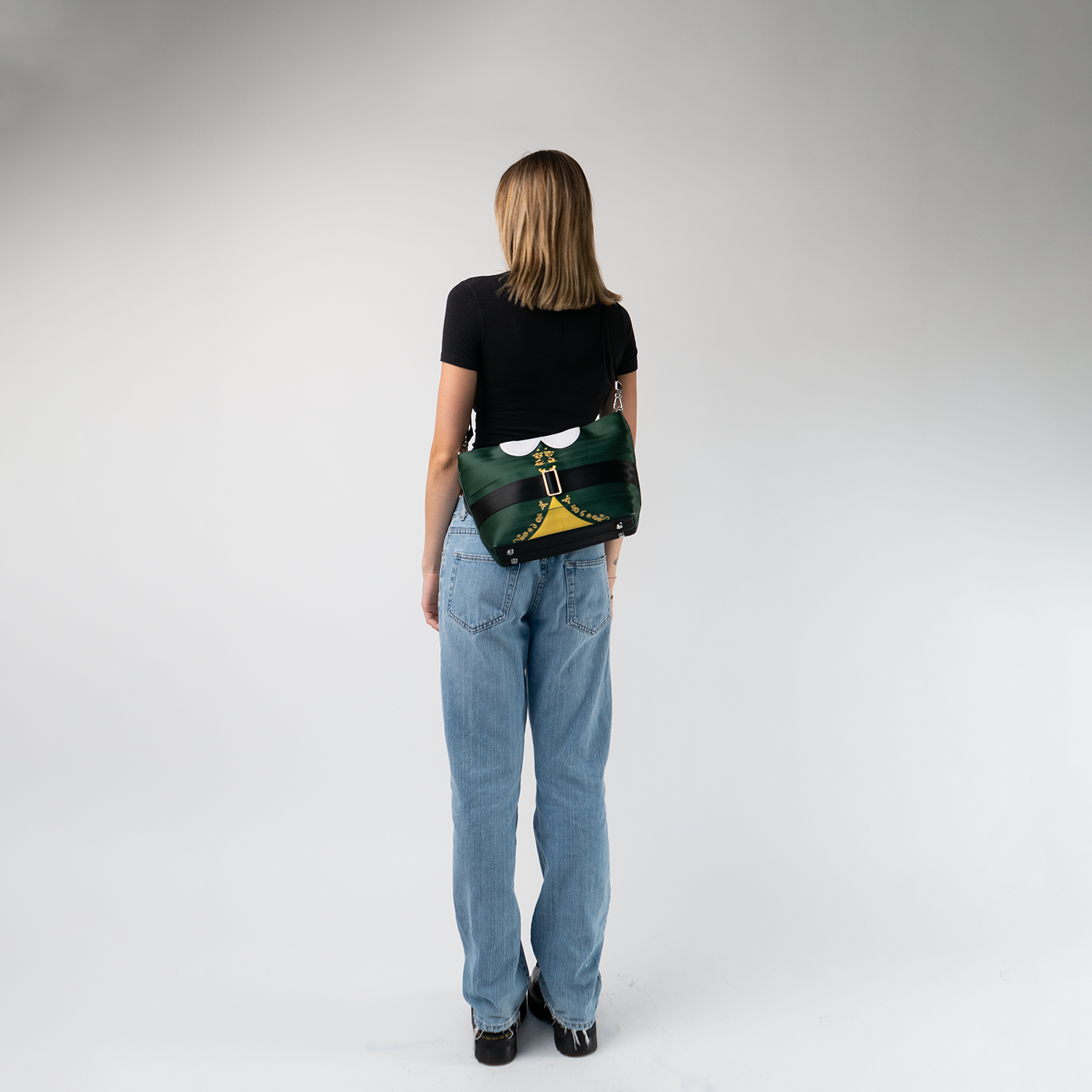 The Elf Mini Streamline Tote being worn on a model