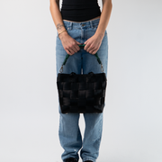 A Forest Lola Click N Carry being used by a model