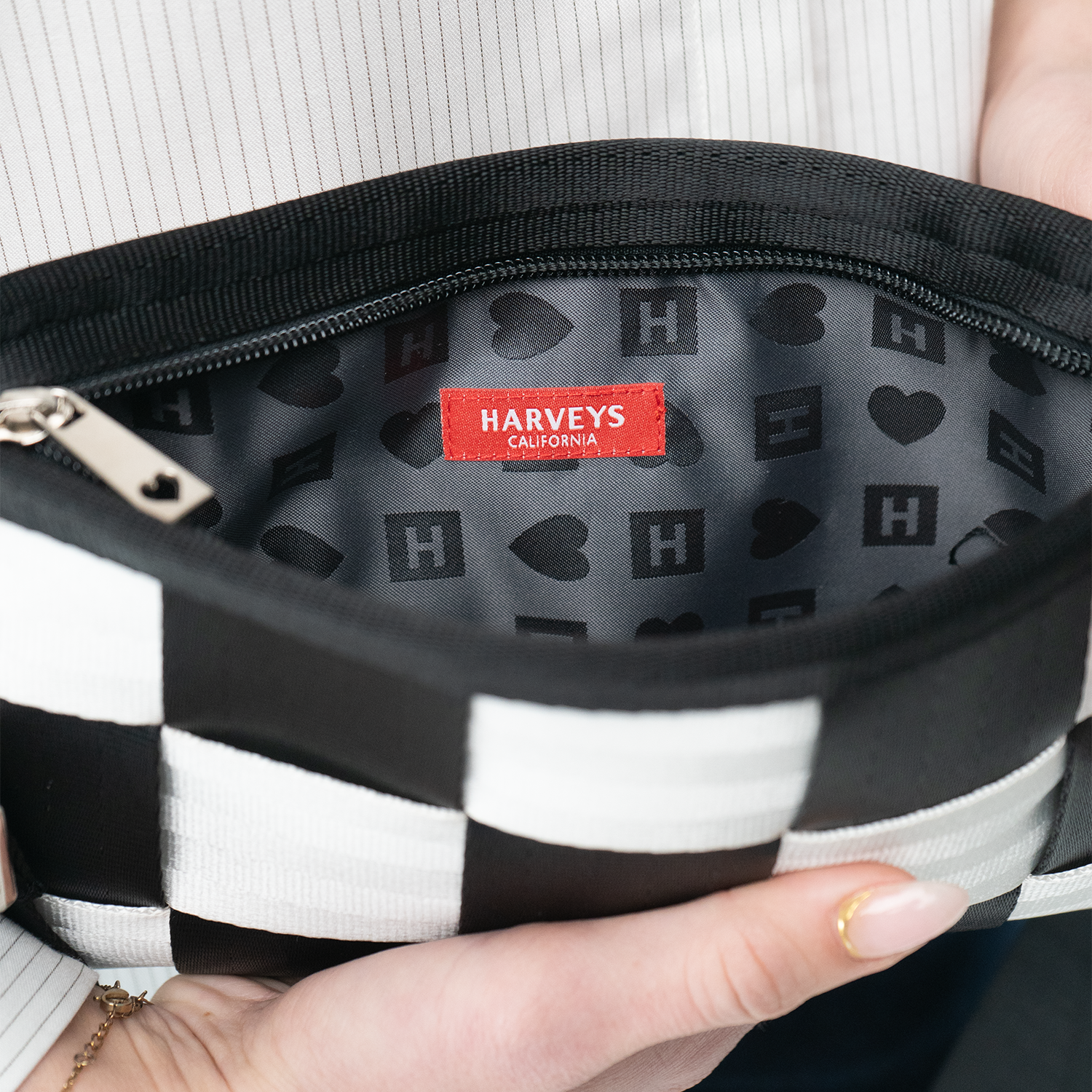 Close-up of a black and white checkered bag with Harveys California label.
