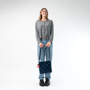 A Mini Messenger in Indigo being held by a Model