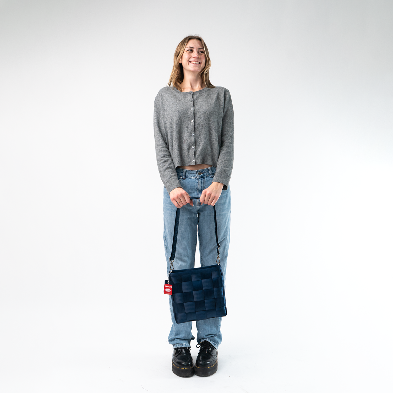 A Mini Messenger in Indigo being held by a Model