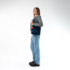A Mini Messenger in Indigo being worn by a Model