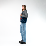 A Mini Messenger in Indigo being worn by a Model