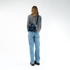 A Woven Petite Tote in Indigo being worn by a Model