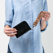 A Picnic 4 Panel Keychain being used by a model