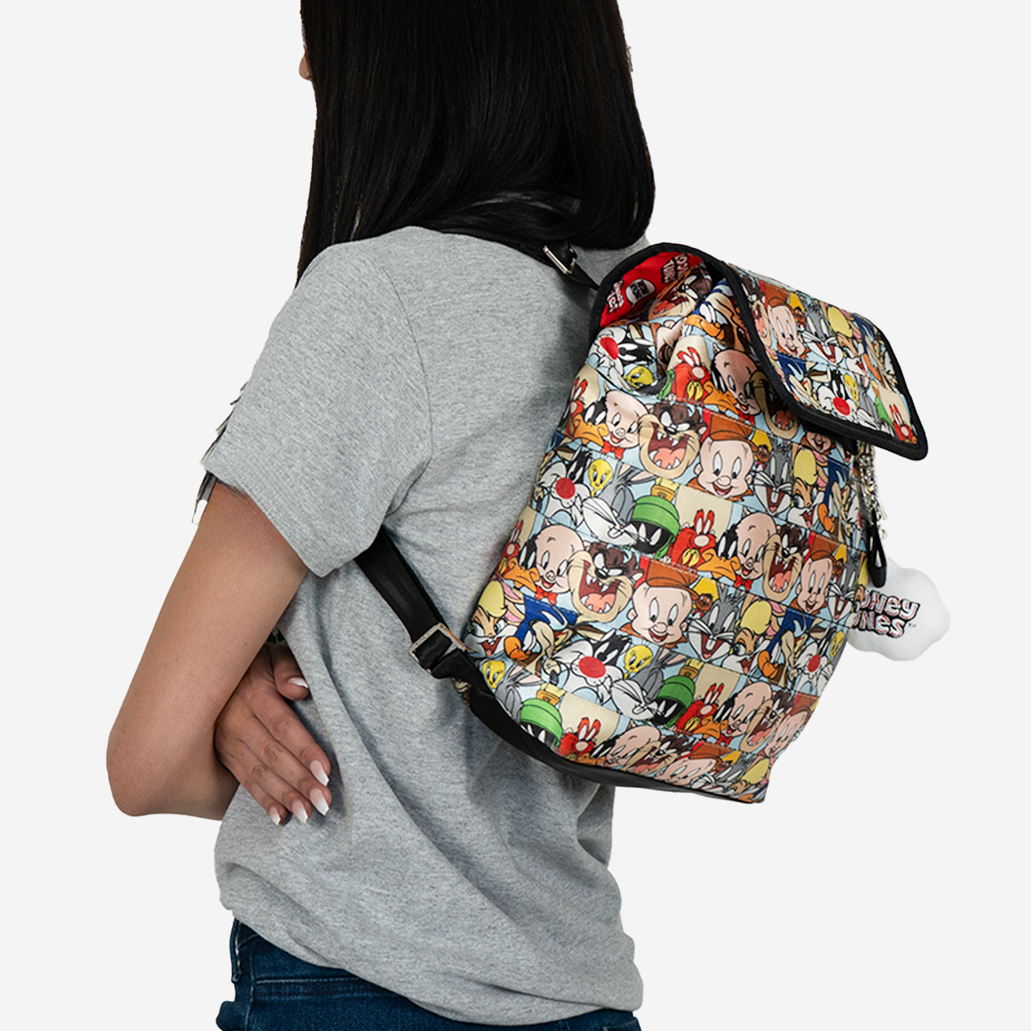 side view of a looney tunes berkeley backpack worn on a model