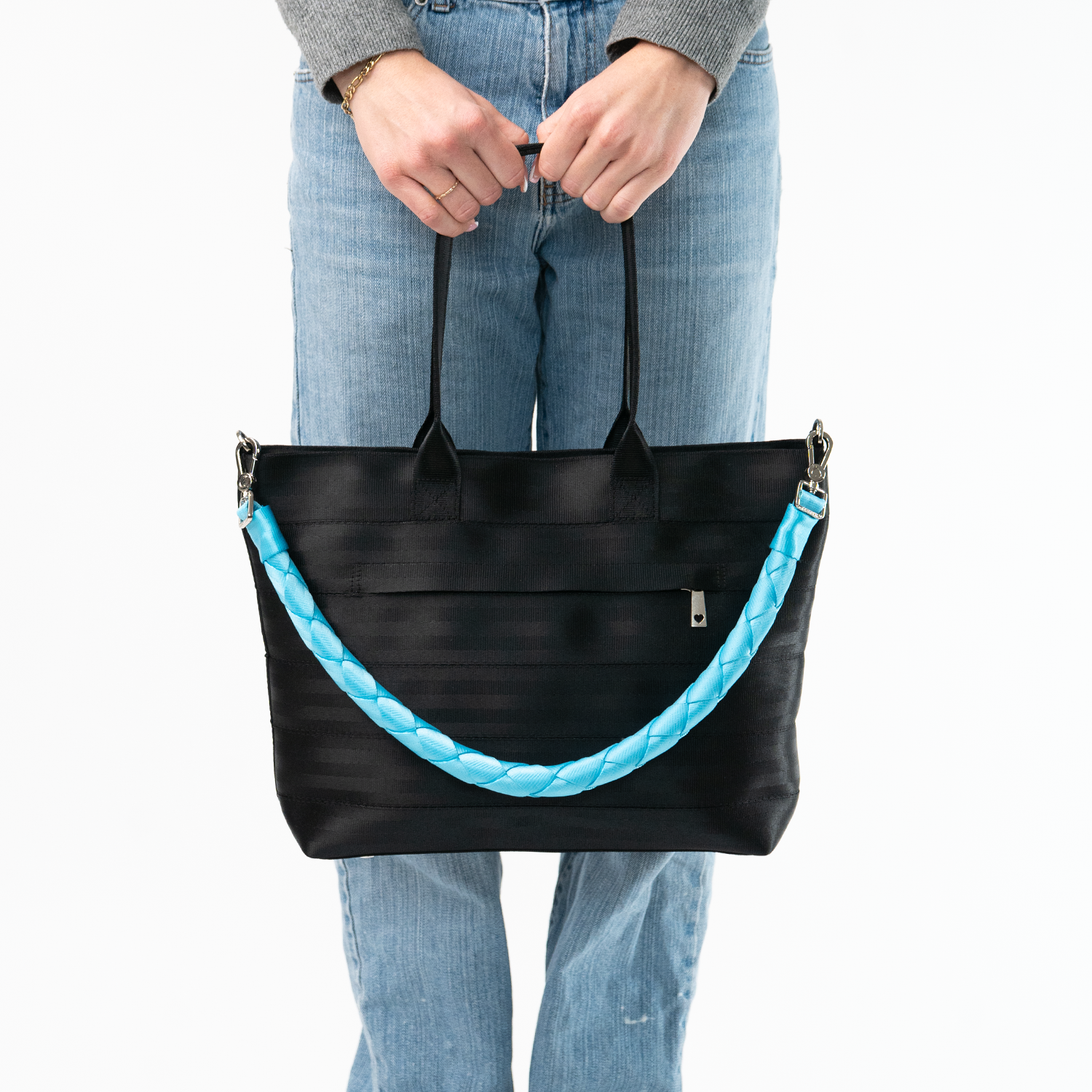 The Maliblue Long Lola Click N Carry being used on a bag by a model
