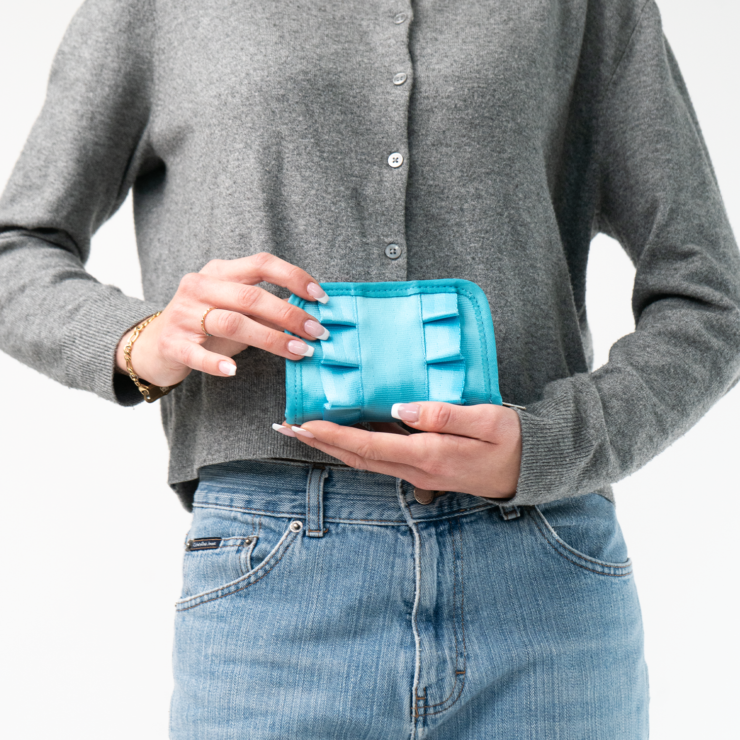 The Maliblue Lola Fun Size Wallet being held in a model's hands