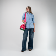 A Watermelon Medium Park Hopper being used by a model