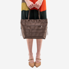 The Medium Streamline Tote in Espresso being worn by a model