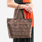 The Medium Streamline Tote in Espresso being worn by a model