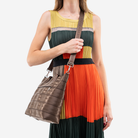 The Medium Streamline Tote in Espresso being worn by a model