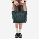 The Medium Streamline Tote in Nori being worn by a model