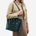 The Medium Streamline Tote in Nori being worn by a model
