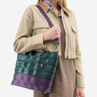 The Medium Streamline Tote in Poison Ivy being worn by a model