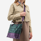 The Medium Streamline Tote in Poison Ivy being worn by a model