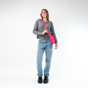 A Mini Messenger in Melon being worn by a Model