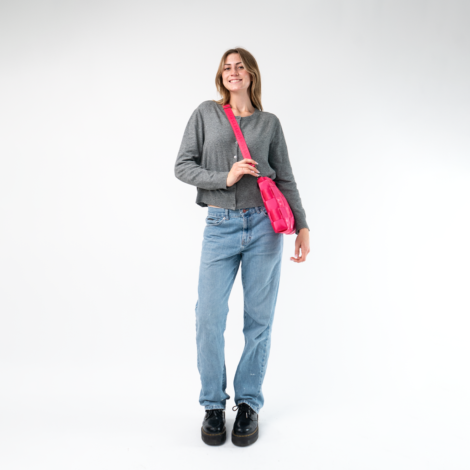 A Mini Messenger in Melon being worn by a Model