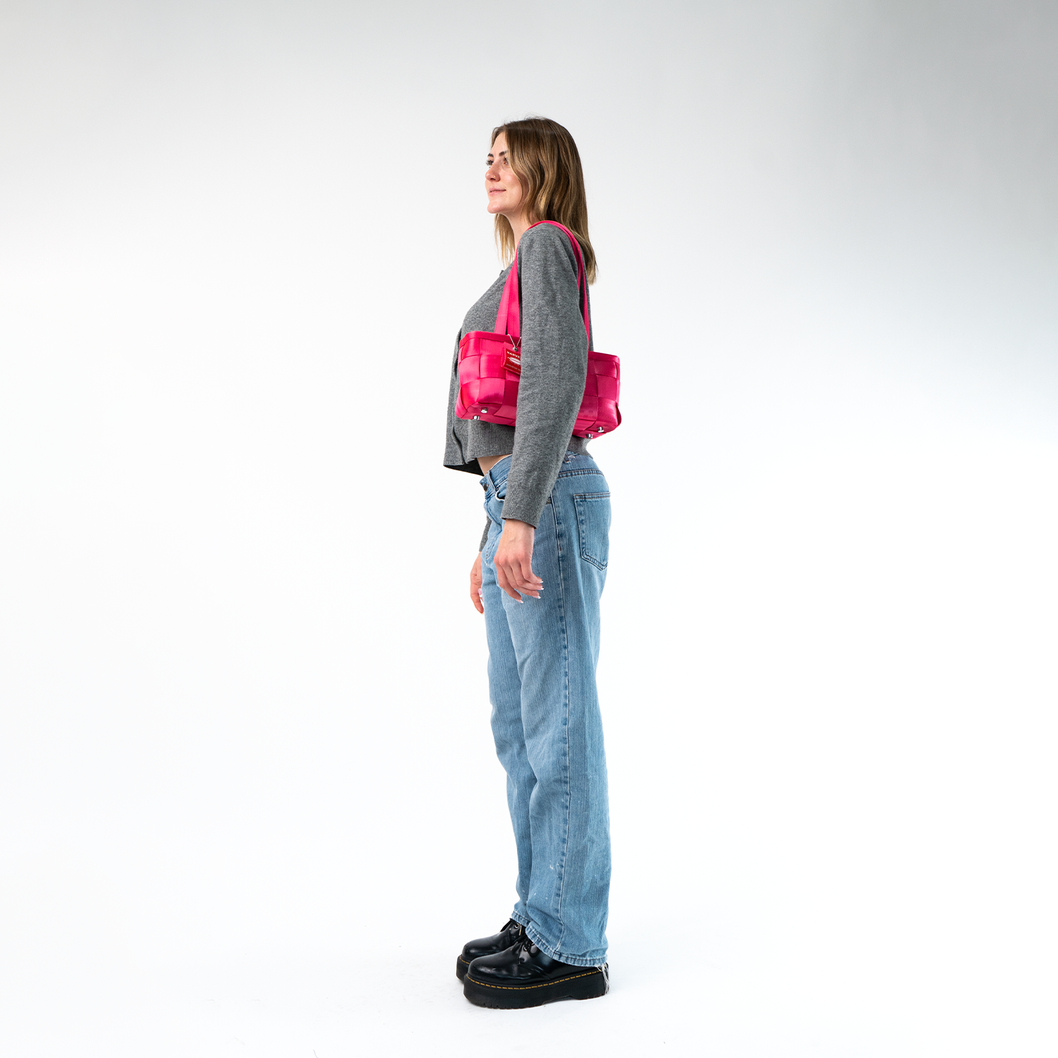 A Satchel in Melon being worn by a Model