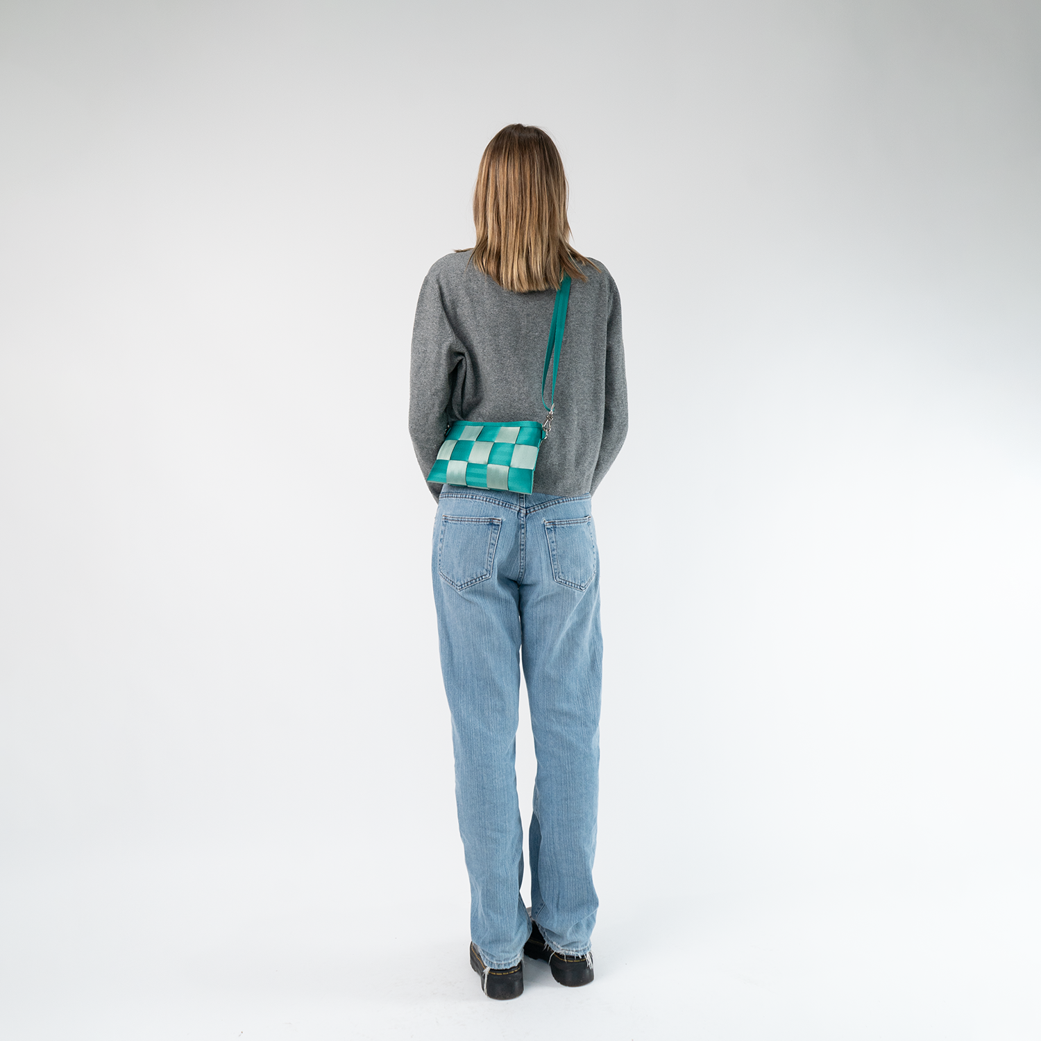 The Mint N Emerald Hip Packbeing worn by a model