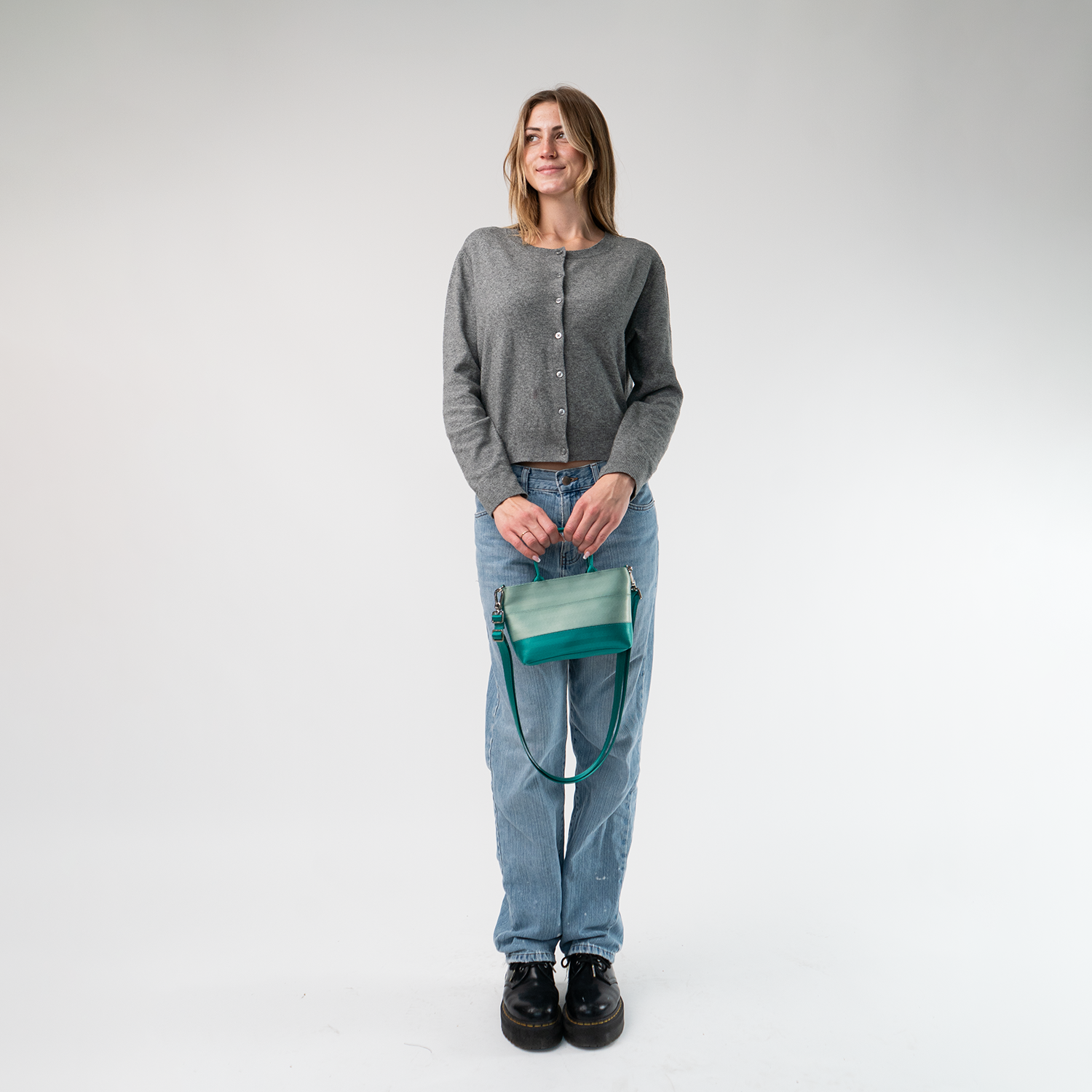 The Mint N Emerald Petite Tote being held in a model's hands