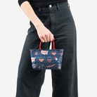 The American Made Petite Tote being held by a model