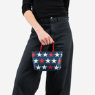 The RWB Stars Petite Tote being held by a model