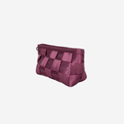 The side of a Plum Triangle Makeup Case