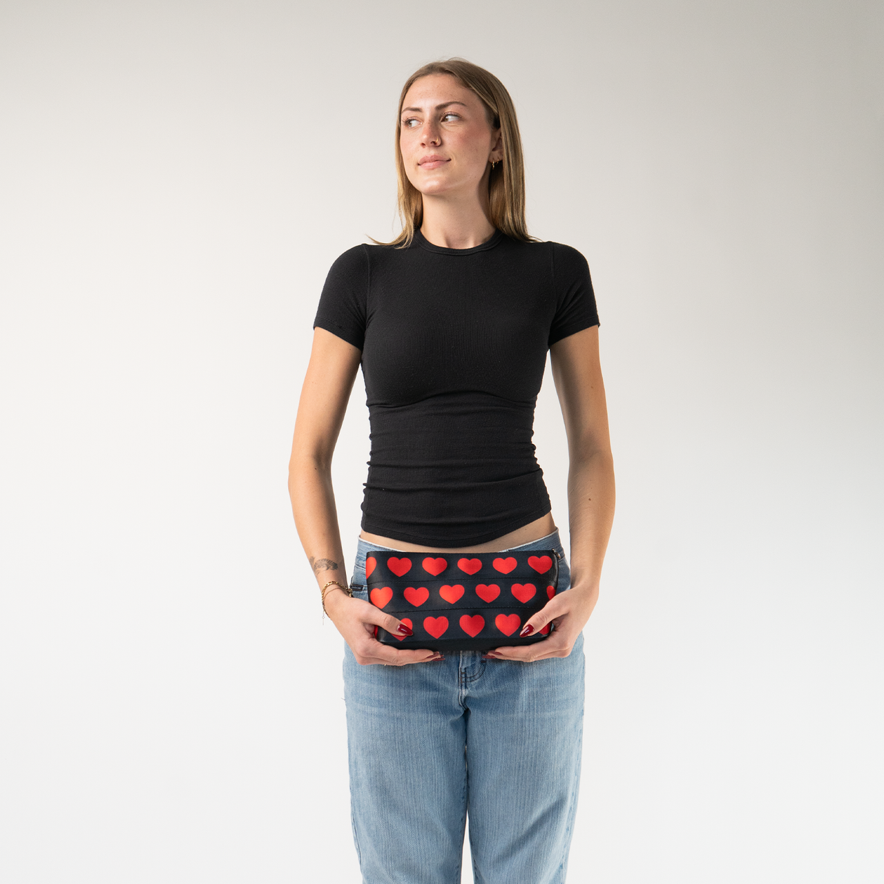 The Queen Of Hearts Makeup Case being held by a model