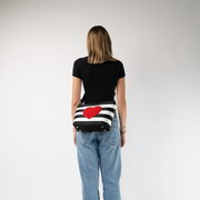 The Queen Of Hearts Mini Streamline Tote being worn by a model
