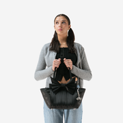 Release The Bats Mini Bow Tote in a model's hands
