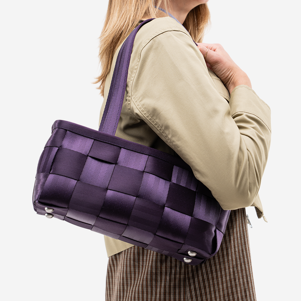 The Satchel in Blackberry being worn by a model