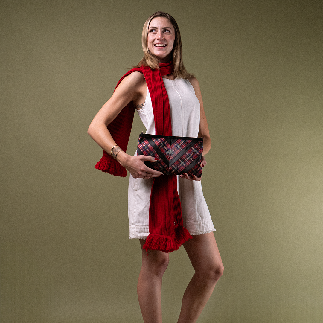 The Tartan Sydney Clutch in a models hands