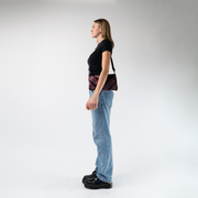 The Tartan Sydney Clutch being worn by a model