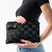 A Tartan Bow Clip being used by a model