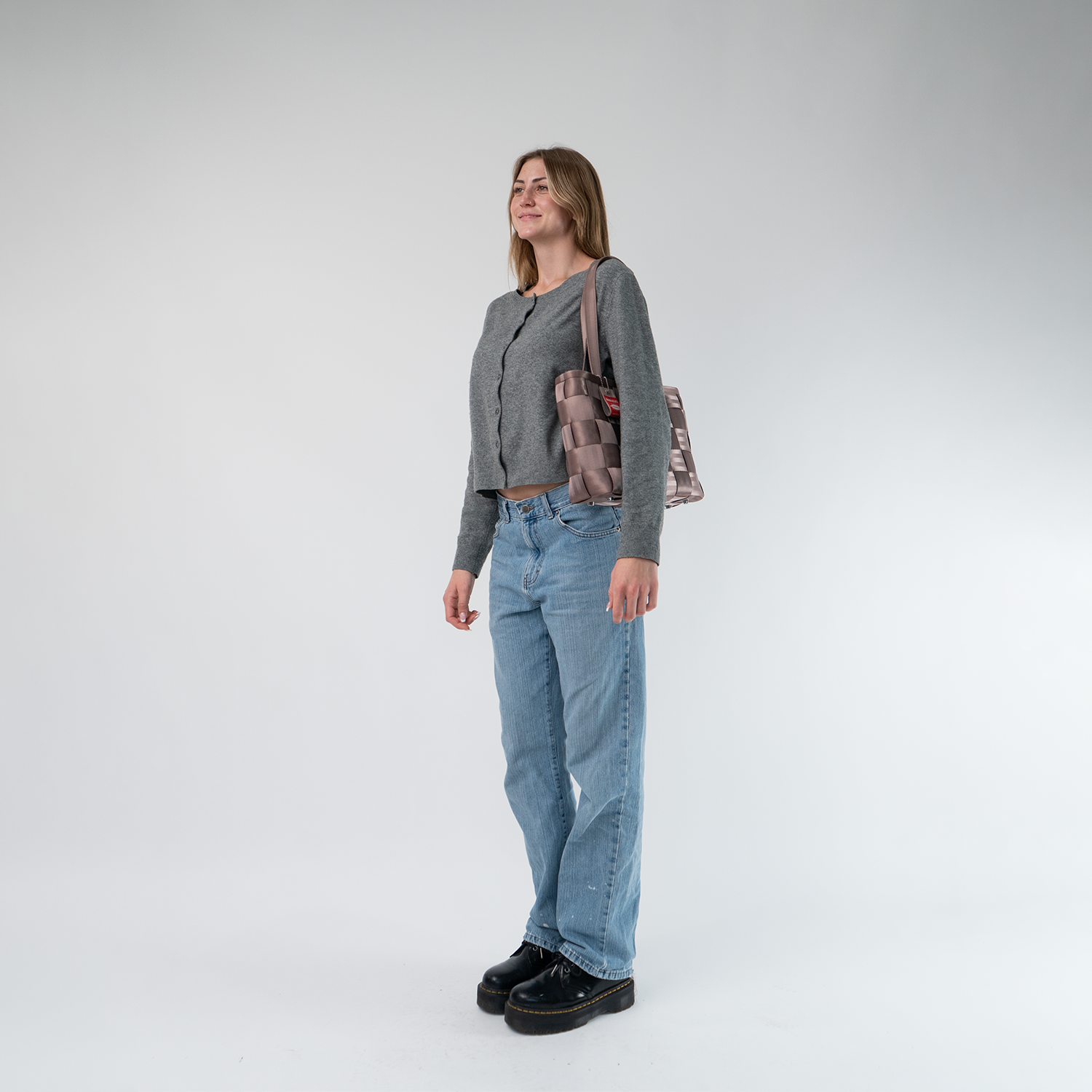 A Large Tote in Taupe being worn by a Model