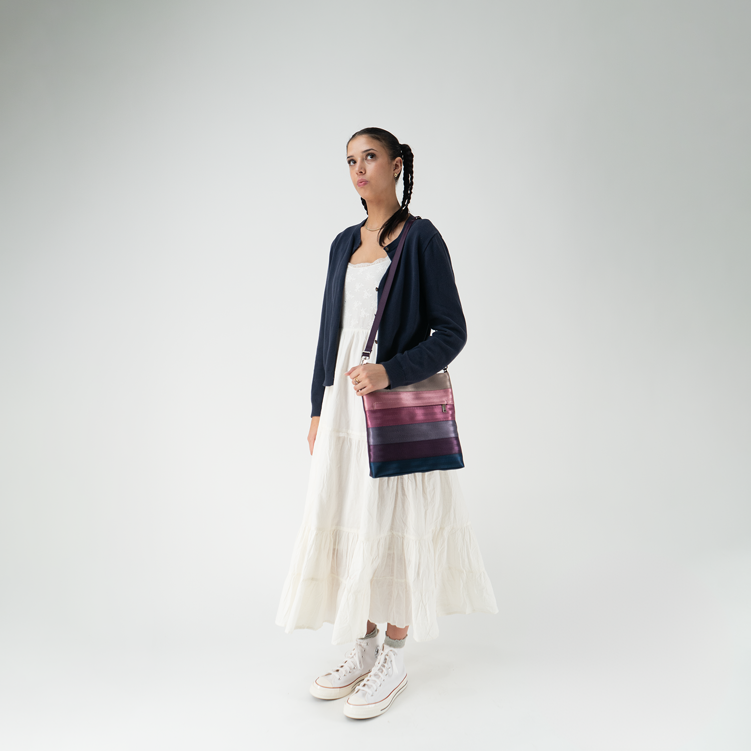 A Streamline Crossbody in Twilight being worn by a model