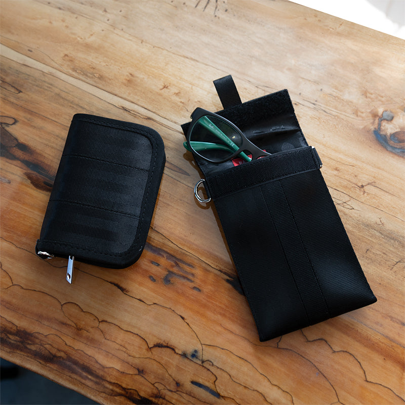 From left to right: Black Fun Size Wallet and Black Travel n Go